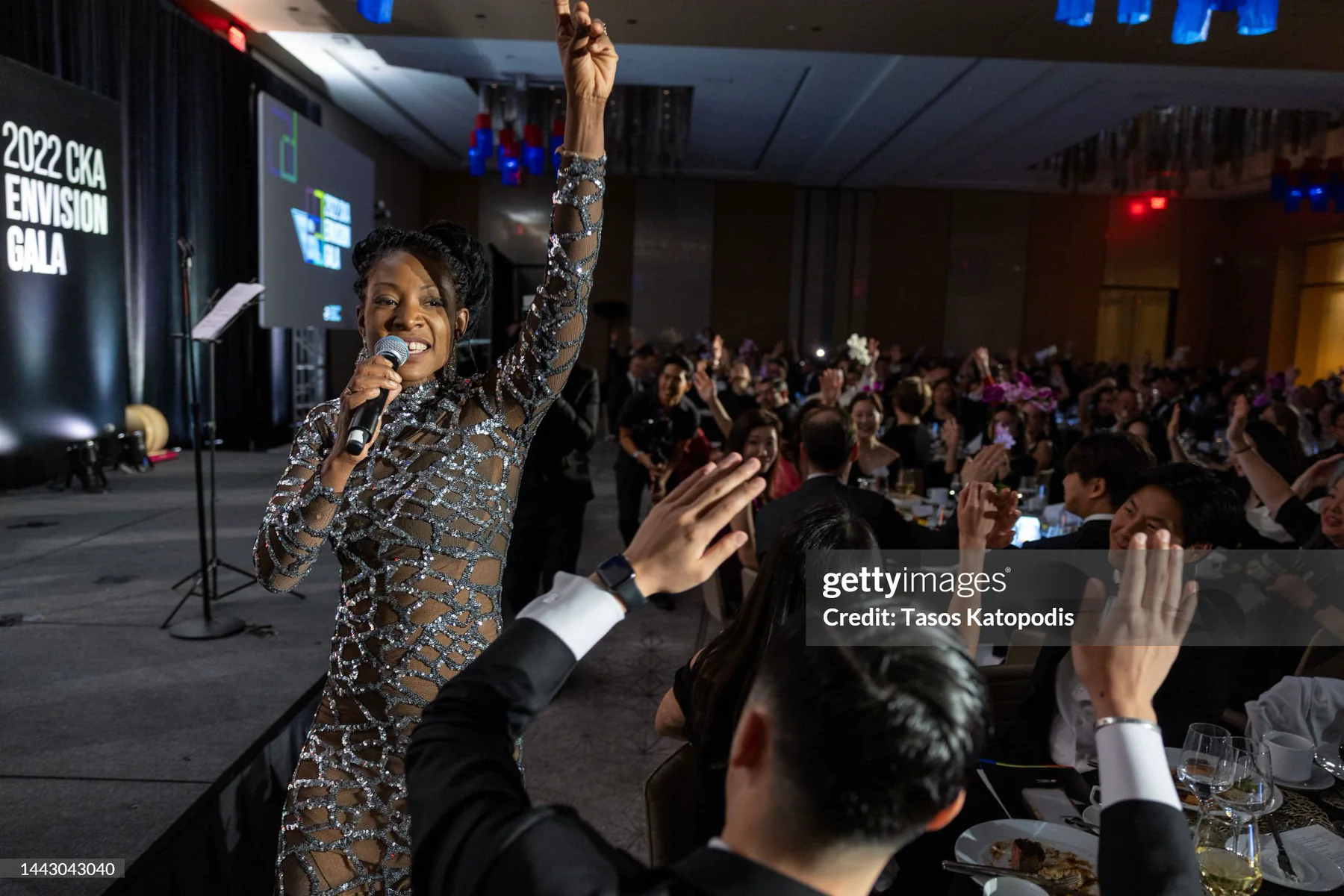 Africa Yoon delivering a spoken-word acceptance performance at a CKA event